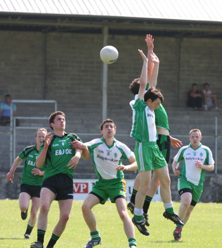 Action from the senior secondary league game against Naomh Bríd.