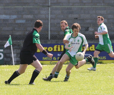 Action from the senior secondary league game against Naomh Bríd.