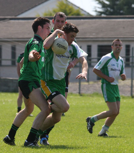 Action from the senior secondary league game against Naomh Bríd.