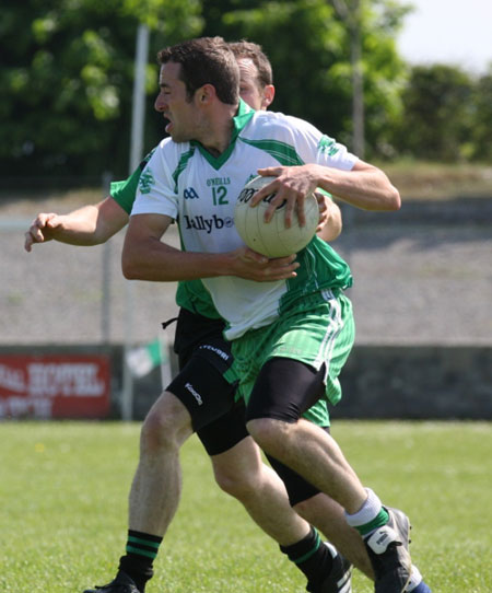 Action from the senior secondary league game against Naomh Bríd.