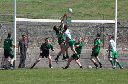 Action from the senior secondary league game against Naomh Bríd.
