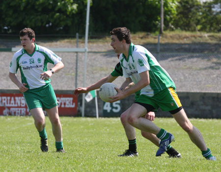 Action from the senior secondary league game against Naomh Bríd.