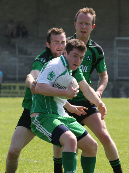 Action from the senior secondary league game against Naomh Bríd.