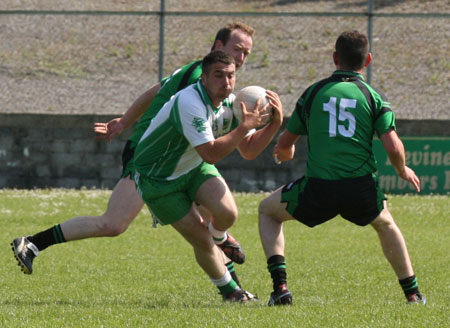 Action from the senior secondary league game against Naomh Bríd.