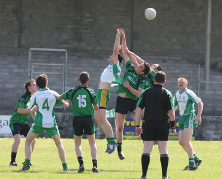 Action from the senior secondary league game against Naomh Bríd.