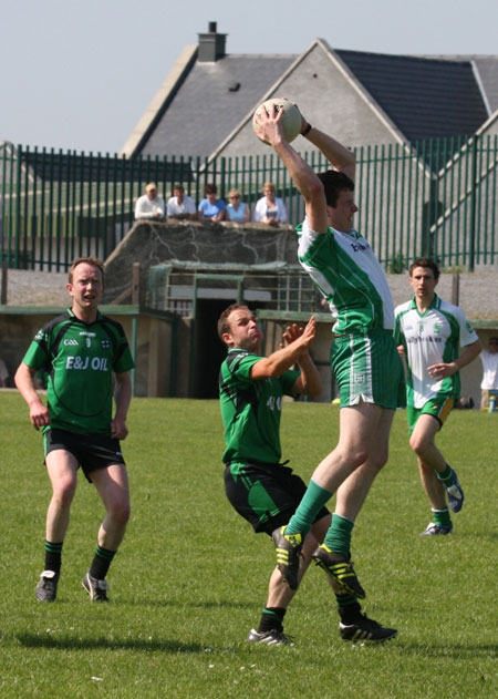 Action from the senior secondary league game against Naomh Bríd.