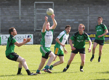 Action from the senior secondary league game against Naomh Bríd.