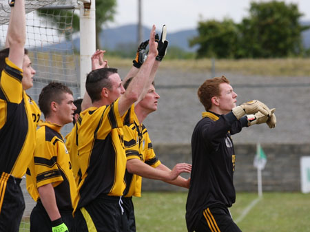 Action from the senior secondary league game against Naomh Brd.