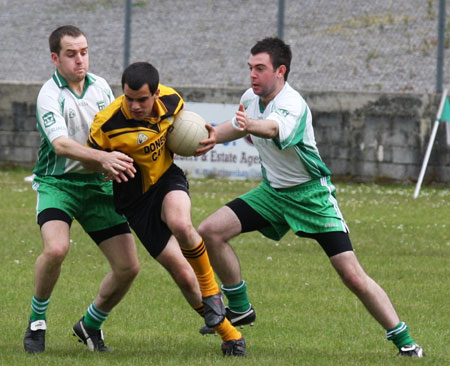 Action from the senior secondary league game against Naomh Brd.