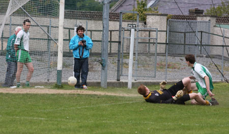 Action from the senior secondary league game against Naomh Brd.