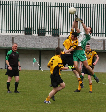 Action from the senior secondary league game against Naomh Brd.