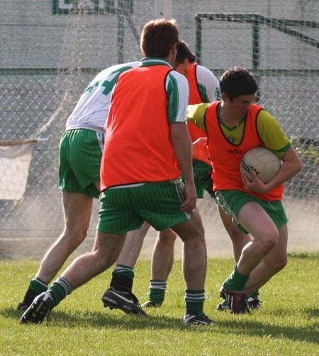 Action from the senior secondary league game against Naomh Brd.