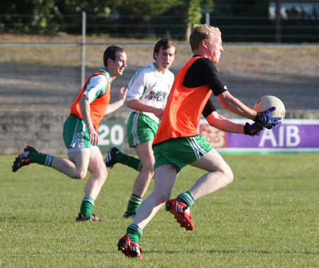 Action from the senior secondary league game against Naomh Brd.