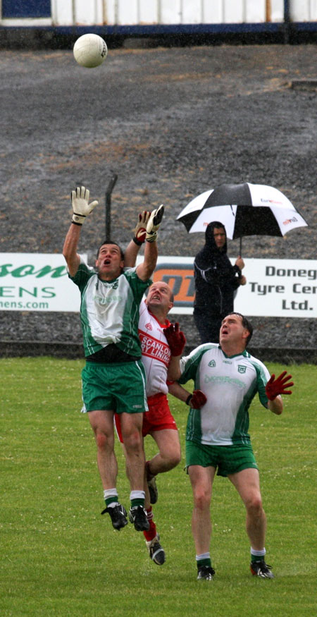 Action from the Junior B championship play-off against Glenfin.