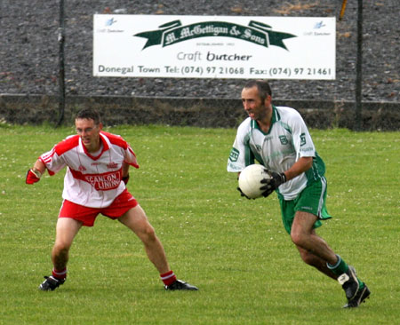 Action from the Junior B championship play-off against Glenfin.