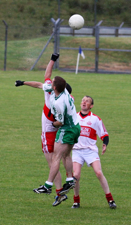 Action from the Junior B championship play-off against Glenfin.