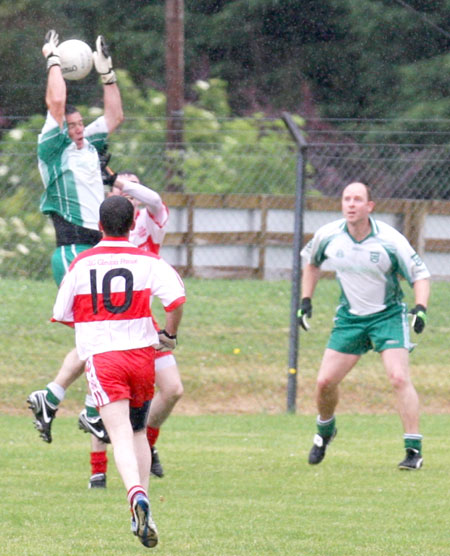 Action from the Junior B championship play-off against Glenfin.