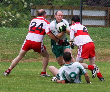 Action from the Junior B championship play-off against Glenfin.