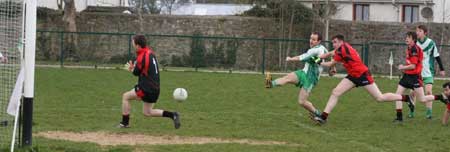 Action from the reserve senior division three match against Naomh Bríd.