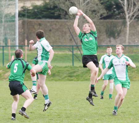 Action from the reserve senior division three match against Naomh Bríd.