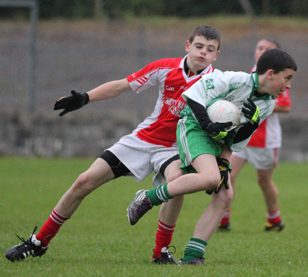 Action from the under 14 match against Dungloe.