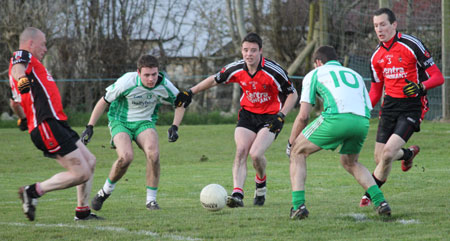 Action from the division three football league match against Urris.