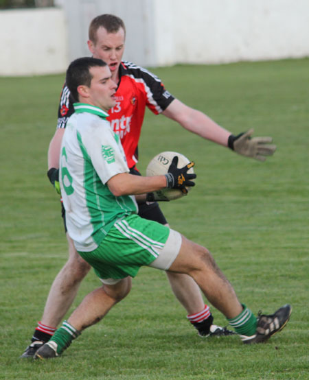 Action from the division three football league match against Urris.