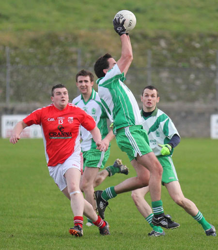 Action from the Senior Reserve Football Division 3 match against Naomh Colmcille.