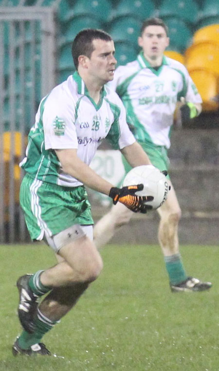 Action from the division three football league play-off match against Naomh Bríd.