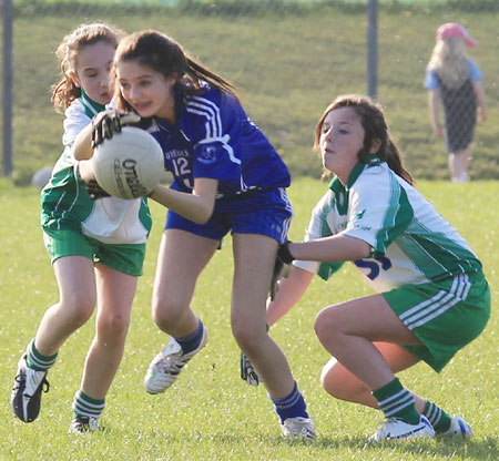 Action from the 2012 ladies under 14 match between Aodh Ruadh and Four Masters.