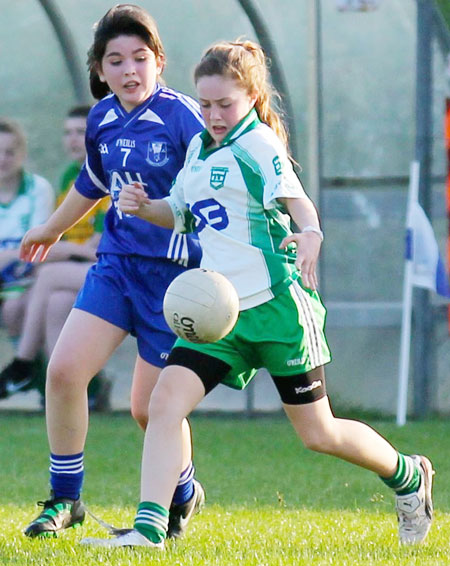 Action from the 2012 ladies under 14 match between Aodh Ruadh and Four Masters.