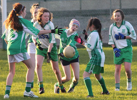 Action from the 2012 ladies under 14 match between Aodh Ruadh and Saint Naul's.