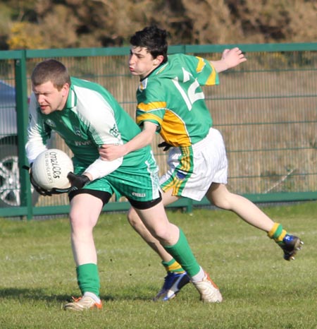 Action from the division three senior reserve football league match against Naomh Columba.