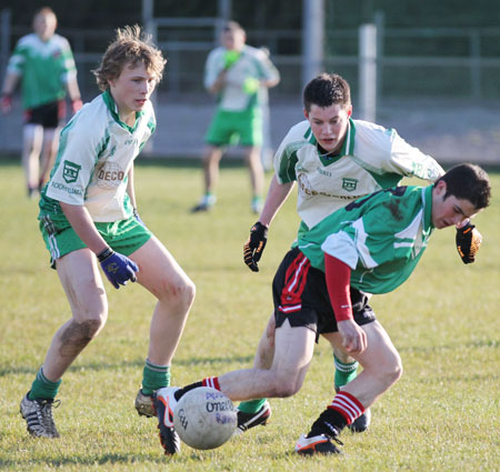 Action from the division three senior reserve football league match against Urris.