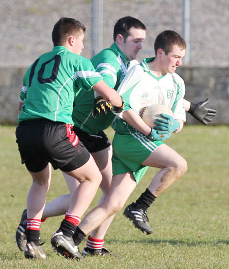 Action from the division three senior reserve football league match against Urris.