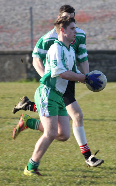 Action from the division three senior reserve football league match against Urris.