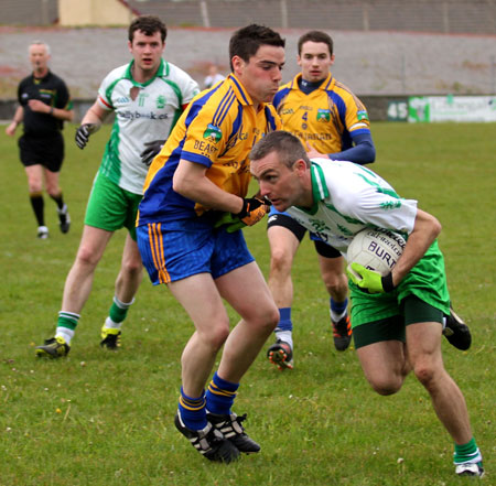 Action from the division three senior football league match against Burt.