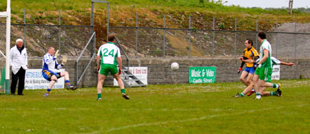 Action from the division three senior football league match against Burt.