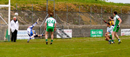 Action from the division three senior football league match against Burt.