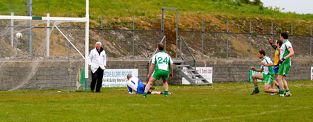 Action from the division three senior football league match against Burt.