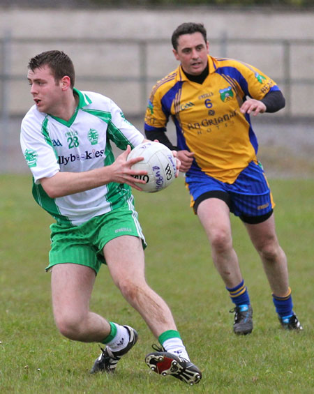 Action from the division three senior football league match against Burt.