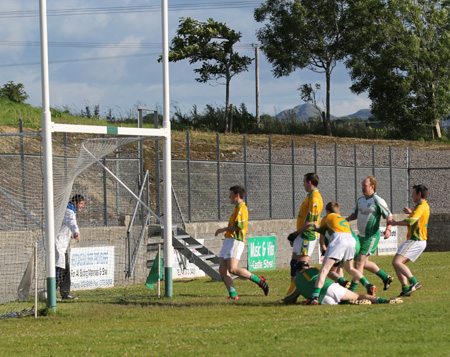 Action from the division three senior reserve football league match against Naomh Columba.