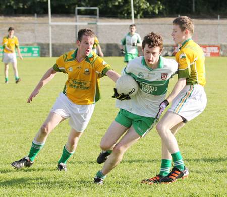 Action from the division three senior reserve football league match against Naomh Columba.