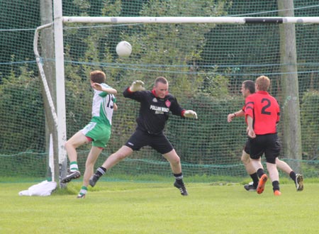 Action from the division three senior reserve football league match against Urris.