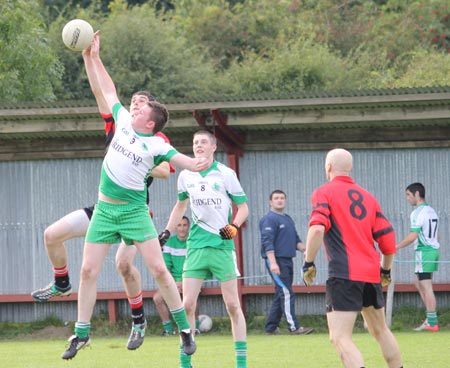 Action from the division three senior reserve football league match against Urris.