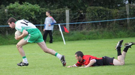 Action from the division three senior reserve football league match against Urris.