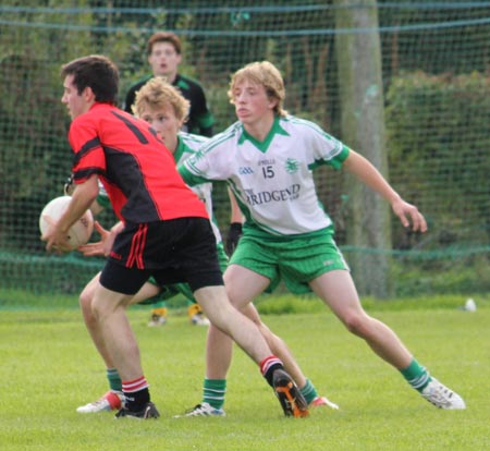 Action from the division three senior reserve football league match against Urris.