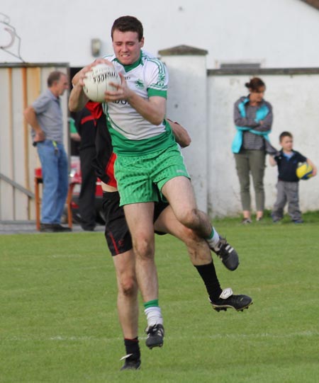 Action from the division three senior reserve football league match against Urris.