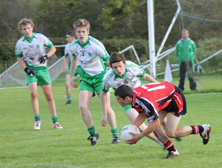 Action from the division three senior reserve football league match against Urris.