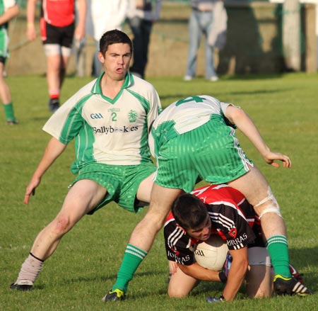 Action from the division three senior reserve football league match against Urris.